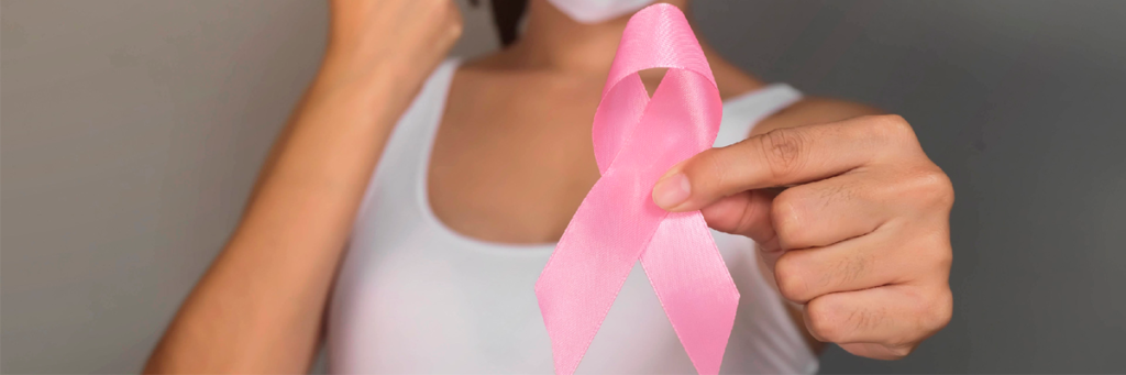cinta rosada con símbolo de prevención de cáncer
